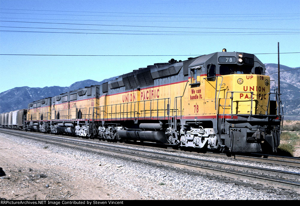 Union Pacific WB with DD35A #78. Large cement pickup from Victorville area on head end.